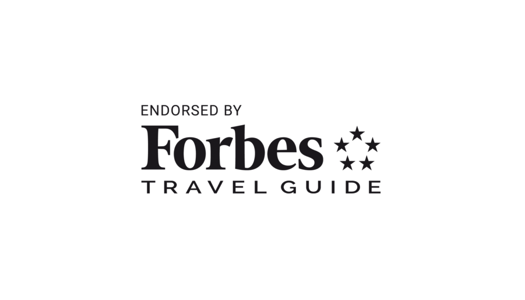 In Travel Solutions, Forbes Logo